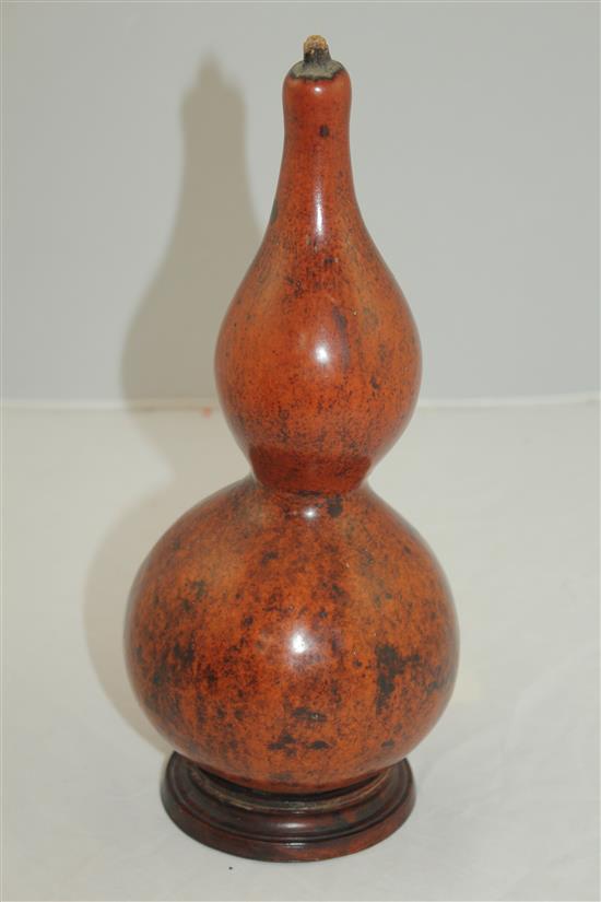 A Chinese gourd and rosewood stand, 19th century, total height 28.5cm